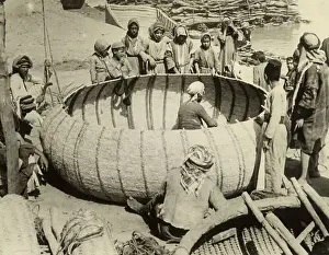 Baghdad Prints: People Watch Man Weave Large Basket