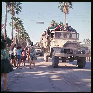 People Waving at Troops