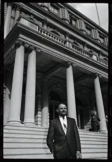Percy Sutton Standing in Front of Building
