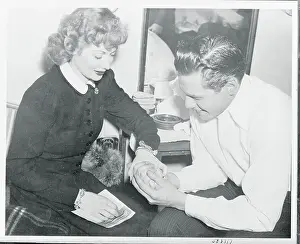 Prints of (Original Caption) Behind the Laughter: Lucille Ball's Unseen Moments: Performer Desi Arnaz Holding Hand of New Wife Lucille Ball