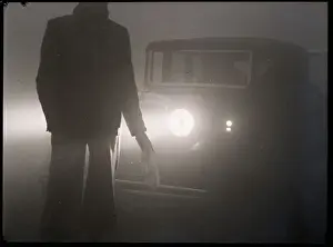 Headlights Prints: Person Guiding Automobile Through Fog