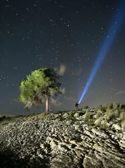 Images Dated 2nd October 2015: Person lighting the sky with a flashlight