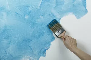 Close Up Gallery: Person painting glaze onto wall with brush