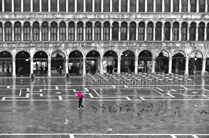 Town Square Prints: One person with a red umbrella crossing the St Marks Square by a rainy day in winter in Venice
