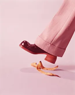 Person about to step on banana skin