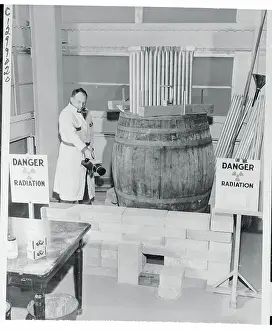 Brookhaven Prints: Person Taking a Radiation Count From a Reactor