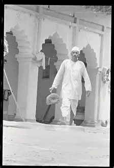 Person Walking with a Trapped Rat
