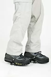 Close Up Gallery: Person wearing boots with crampons, low section