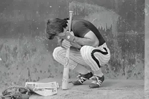 Pete Rose Stooping and Leaning on Baseball Bat