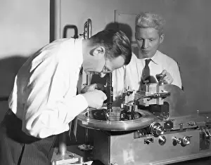 Peter Goldmark Examining Phonograph Record