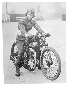 P.G. Dallison Sitting on a Motorcycle