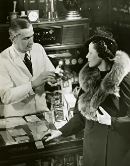 Pharmacist fills prescription for woman