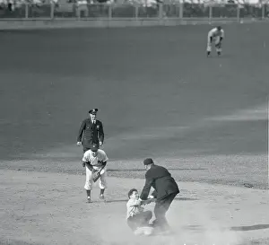 Phil Rizzuto, Cal Hubbard, and Policeman Watching Fan