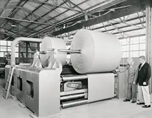 Philip J. McGuire and Edwin Hoyt Inspecting Paper Splicer