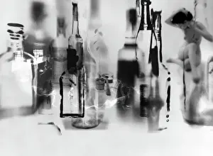 Prints of NEW YORK - 1960: An artistic photo montage (created in the darkroom by layering negatives together) of a drug and alcohol-fueled party, with a naked woman and an acoustic guitar Portraits, Artworks, and Montages from a Visionary Photographer: Photo Montage of Alcohol-Fueled Party in 1960