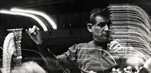 Prints of NEW YORK - 1959: A photo montage of composer and conductor Leonard Bernstein rehearsing at Carnegie Hall in 1959 in New York City, New York. (Photo by David Attie/Getty Images) Portraits, Artworks, and Montages from a Visionary Photographer: Photo Montage of Leonard Bernstein Rehearsing At Carnegie Hall