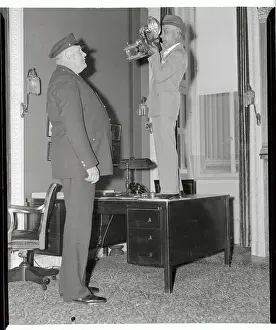 Photographer on Desk Photographing Cop