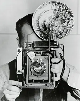 Photographing Prints: Photographer with a Flash Bulb Camera