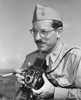 Photographer Joe Rosenthal in Uniform Holding Camera