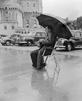 Monaco Prints: Photographer Sitting Under Umbrella