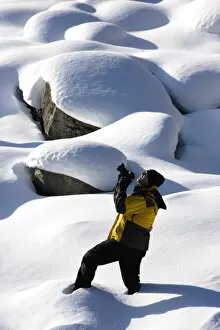 Recreational Pursuit Collection: Photographer in the snow, Jasper National Park, Alberta, Canada