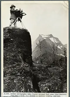 Photographer Standing on Crag