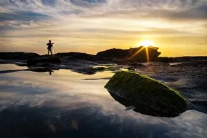 Images Dated 19th June 2015: A photographer and sunset at Melasti beach, Bali