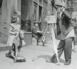 50 54 Years Prints: Photographer is taking picture of girl (6-7) sitting on toy horse