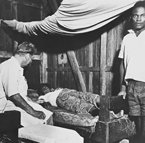 Caring Prints: Physician Albert Schweitzer Visiting a Patient