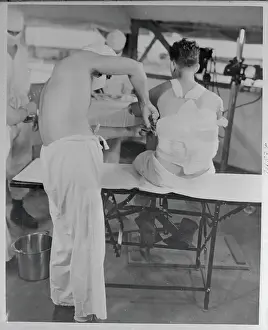 Physician at US Marine Hospital Tending to Patient