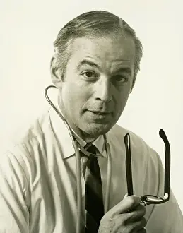 50 59 Years Prints: Physician wearing stethoscope, (B&W), (Portrait)
