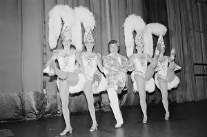 Pianist and Entertainer Liberace Dancing with Four Rockettes