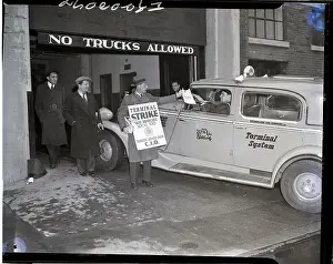 Picket Hands Strike Notice to Cab Driver