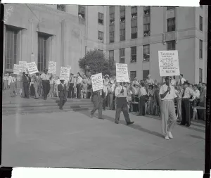 Birmingham Prints: Picketers Carrying Signs in Front of Building