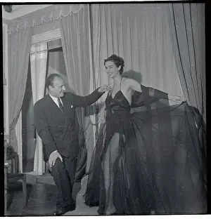 Pierre Balmain Adjusting Shoulder Strap of Model