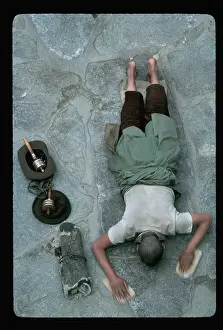Pilgrim Prostrates Himself at Temple
