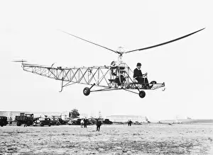 Helicopter Prints: Pilot Flying Primitive Helicopter