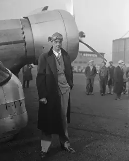 Pilot Howard Hughes Standing in Front of Airplane