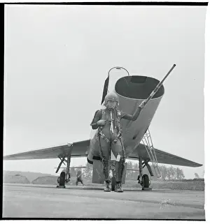 Pilot Posing Near a Supersonic Jet