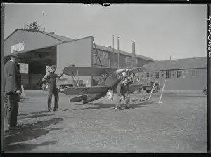 Pilot Posing with His Plane
