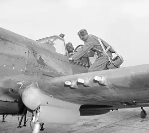 Pilot on Wing of Fighter Plane