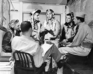 Mission Prints: Pilots and Crew Discussing Mission Results