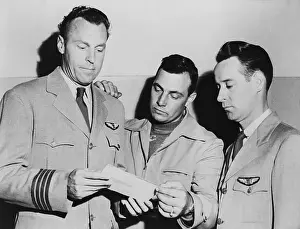 Pilots Looking at Photo of UFO