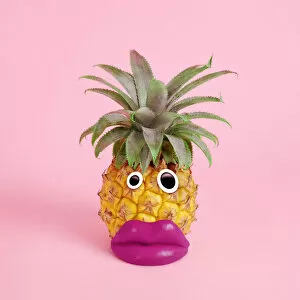 Pink Collection: pineapple with face made of fake lips and googly eyes