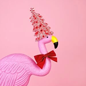 Decoration Collection: Pink flamingo wearing candy cane hat