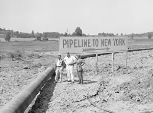 Pipeline With Sign Pointing To New York