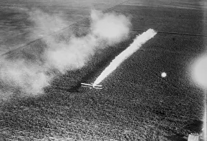 Plane Crop-Dusting a Field