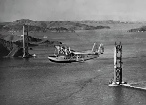 Plane Flies Past Golden Gate Bridge Under Construction