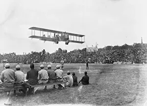 Plane Flying Over Stadium