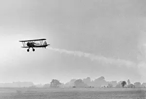 Plane Taking Off for DDT Dispersal Flight